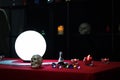 Luminous crystal ball and cards on magnificent fortune telling table Royalty Free Stock Photo