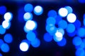 Defocused blue lights on dark blurred background with bokeh effect for wallpaper Royalty Free Stock Photo