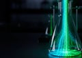 Luminous digital streams in a laboratory flask. Space for text. Royalty Free Stock Photo