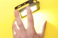 Luminous diode floodlight that holds a male hand. Lighting device. Modern energy-saving technologies. Copy space for text Royalty Free Stock Photo