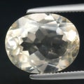 Luminous Elegance: Detailed Close-Up of a Pristine White Beryl Gemstone in Precision Clasp Royalty Free Stock Photo
