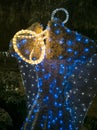 A luminous figure of an Angel in the city of Athens at Christmas