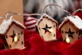 Luminous garland in the shape of wooden houses. Beautiful Christmas and New Year greeting card.