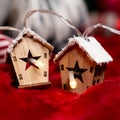 Luminous garland in the shape of wooden houses. Beautiful Christmas and New Year greeting card.