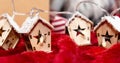 Luminous garland in the shape of wooden houses. Beautiful Christmas and New Year greeting card.