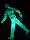 Luminous green walking sign