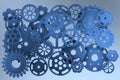 Blue mechanical pieces over blue background