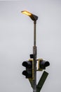 Luminous lamp over a tram traffic light Royalty Free Stock Photo