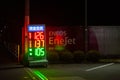 Luminous panel with fuel prices in the ENEOS gas station self-service at night. Horizontal shot
