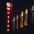 Luminous sign on a house in the city. Germany, Kassel