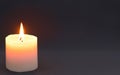 Luminous Solitude: Single Candle Against a Black Background