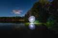 Luminous sphere near the lake