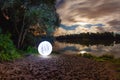 Luminous sphere near the lake