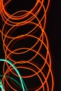 Neon green and red thin wire. Luminous wires, decoration and illumination of the surface. Electroluminescent wire, lighting object