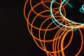 Neon green and red thin wire. Luminous wires, decoration and illumination of the surface. Electroluminescent wire, lighting object
