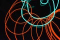 Neon green and red thin wire. Luminous wires, decoration and illumination of the surface. Electroluminescent wire, lighting object