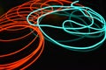 Neon green and red thin wire. Luminous wires, decoration and illumination of the surface. Electroluminescent wire, lighting object
