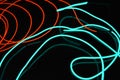 Neon green and red thin wire. Luminous wires, decoration and illumination of the surface. Electroluminescent wire, lighting object