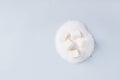 Lump sugar on a pile of granulated sugar  on a blue background top view copy space Royalty Free Stock Photo