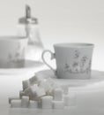 Lump sugar and porcelain crockery Royalty Free Stock Photo