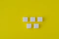 Lump sugar on yellow background. Abstract pattern. Chessboard pattern Royalty Free Stock Photo