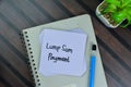 Lump Sum Payment write on sticky notes isolated on Wooden Table