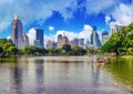 Lumpini Park , lake , modern apartments in downtown Bangkok Royalty Free Stock Photo