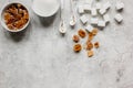 Lumps of white and brown sugar on gray table background top view mock up Royalty Free Stock Photo