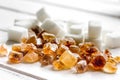 lumps of white and brown sugar on white wooden table background Royalty Free Stock Photo