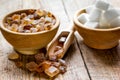 Lumps of white and brown sugar on wooden table background Royalty Free Stock Photo