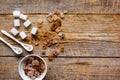 Lumps of white and brown sugar on wooden table background top view mock up Royalty Free Stock Photo