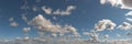 Lumpy clouds bounce across sky panorama Royalty Free Stock Photo