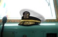 United State Navy USN officer`s hat on naval ship`s command bridge at Malaysian