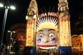 Luna Park main gate with Ferris wheel blur lighted at night Royalty Free Stock Photo