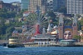 Luna Park Sydney seen from afar with ferry on the left leaving the wharf station Royalty Free Stock Photo