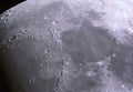 Lunar craters are photographed in kupon plan through the Newton system`s mirror telescope. Mid-range amateur astrophotography to Royalty Free Stock Photo