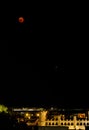 Lunar Eclipse and Mars planet at the night sky above the buildings of Palma de Mallorca, Spain Royalty Free Stock Photo