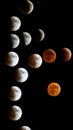 Lunar eclipse sequence against a black background, showing phases of the moon. Royalty Free Stock Photo