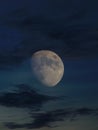 Lunar eclipse whit clouds in blue hour Royalty Free Stock Photo