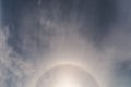 Lunar halo among the clouds at night with stars