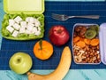 Lunch box with appetizing food and on light wooden table Royalty Free Stock Photo