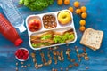 Lunch box with appetizing food on wooden table Royalty Free Stock Photo