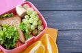 Lunch box with appetizing food on wooden table Royalty Free Stock Photo