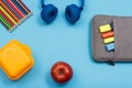 Lunch box, color pencils, headphones, apple and bag-pencil case Royalty Free Stock Photo