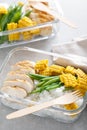 Lunch box containers with grilled chicken, rice and green beans with corn Royalty Free Stock Photo