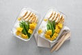 Lunch box containers with grilled chicken, rice and green beans with corn Royalty Free Stock Photo