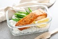 Lunch box containers with grilled salmon fish fillet, rice and green beans Royalty Free Stock Photo