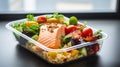 Lunch box containers with grilled salmon fish fillet, rice and salad Royalty Free Stock Photo