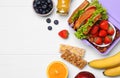 Lunch box with healthy food on white wooden table, flat lay. Space for text Royalty Free Stock Photo