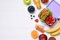 Lunch box with healthy food on white wooden table, flat lay. Space for text Royalty Free Stock Photo